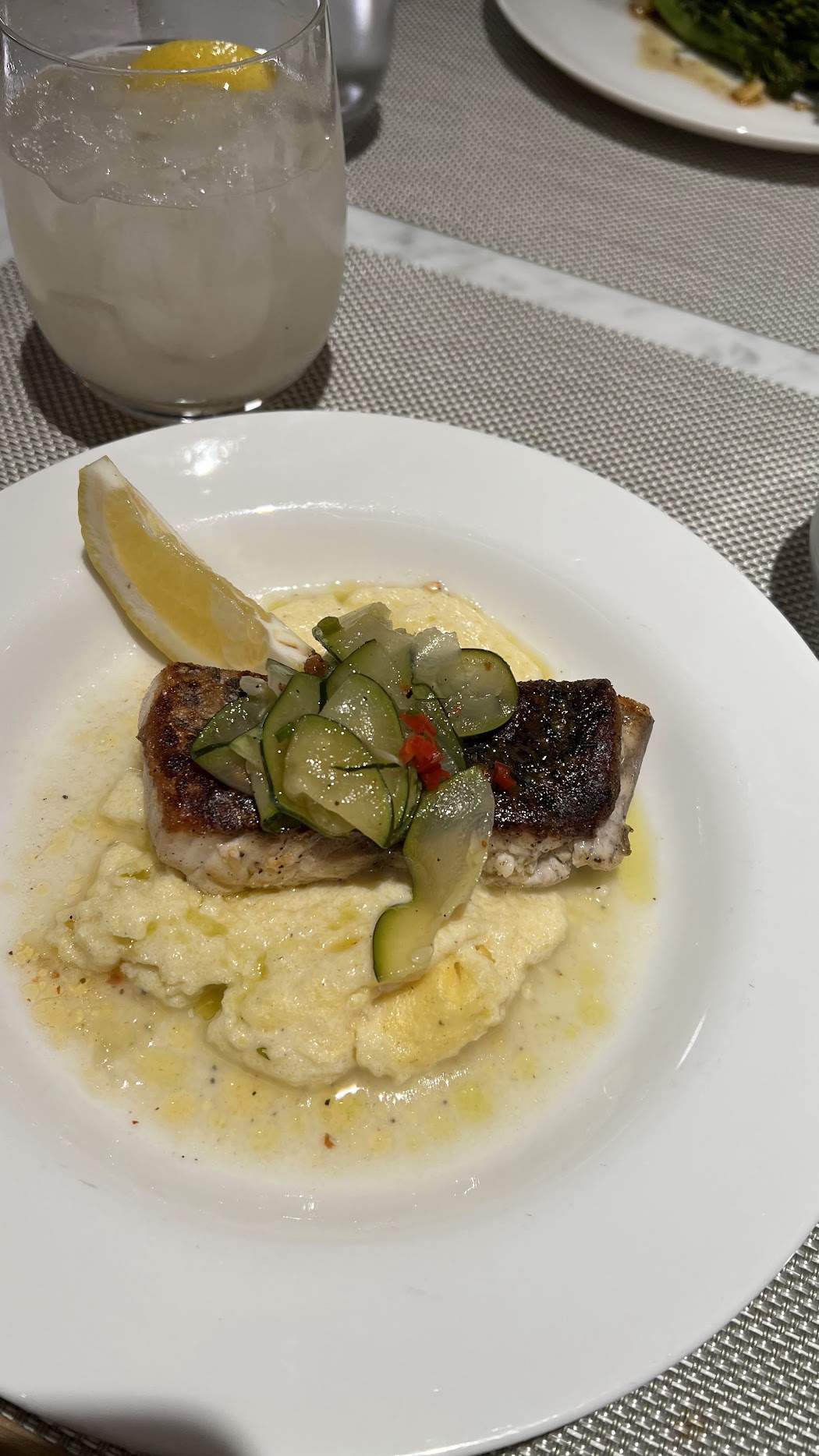 Barramundi with polenta, basil and zucchini sauce