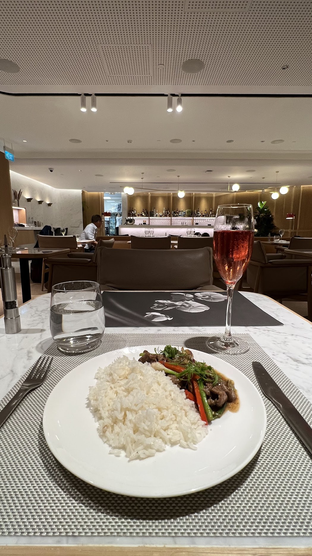 Beef with jasmine rice, and a glass of champagne