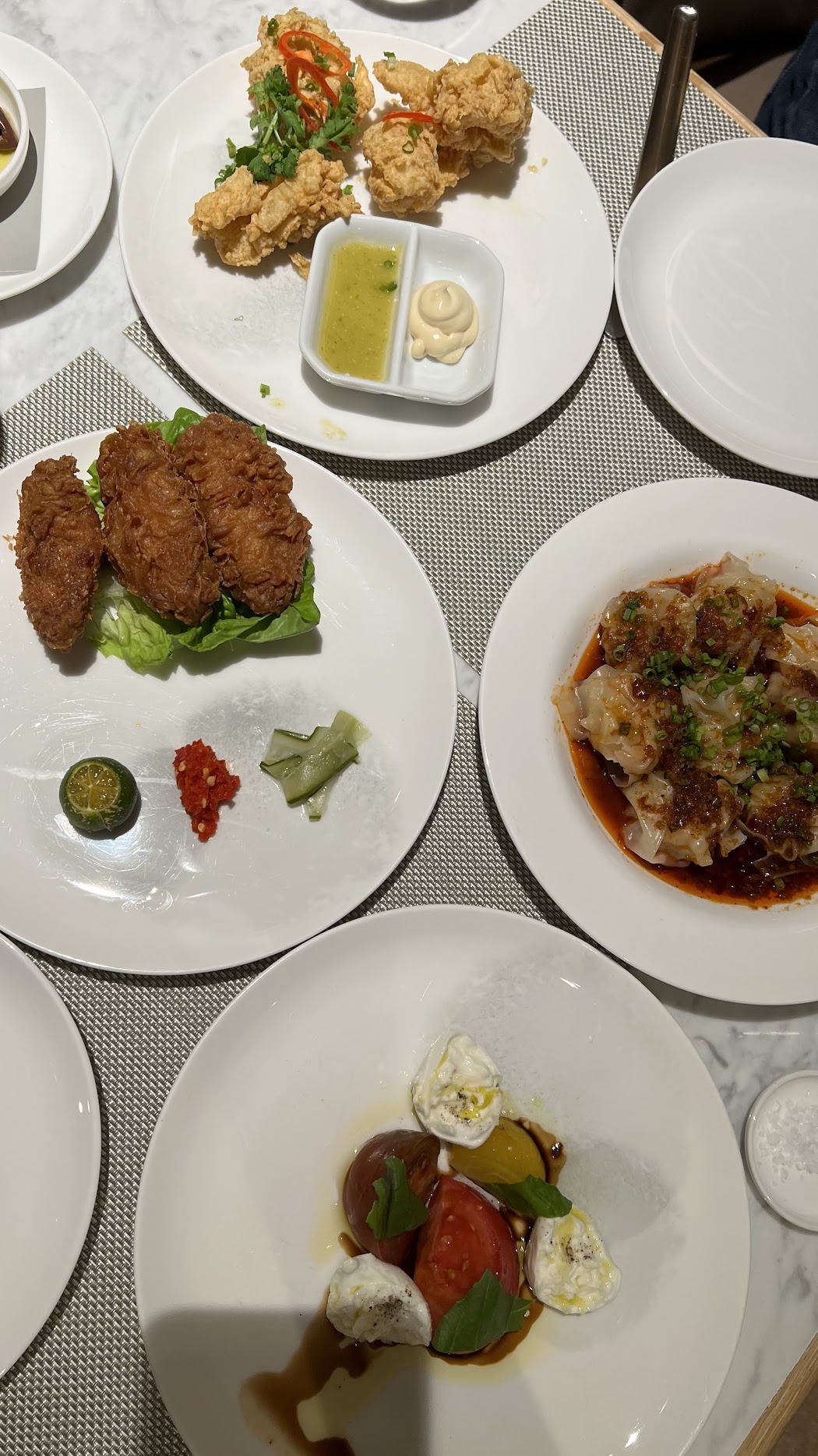 Chef Linda's prawn paste chicken, prawn wantons, and heirlmon tomato with mozzarella