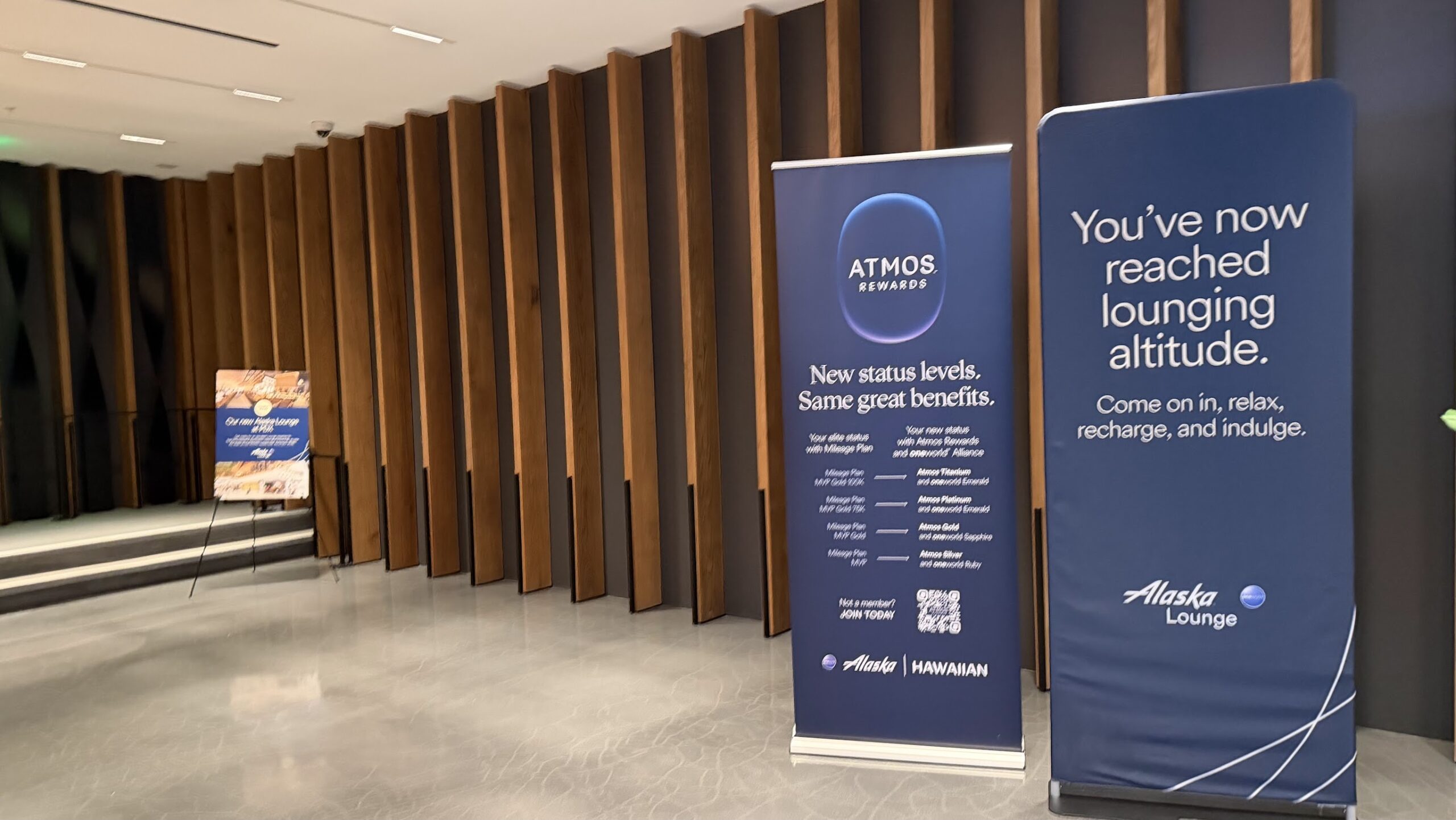 Alaska Airlines Lounge SFO entrance with signs of the new Atmos frequent flyer programme