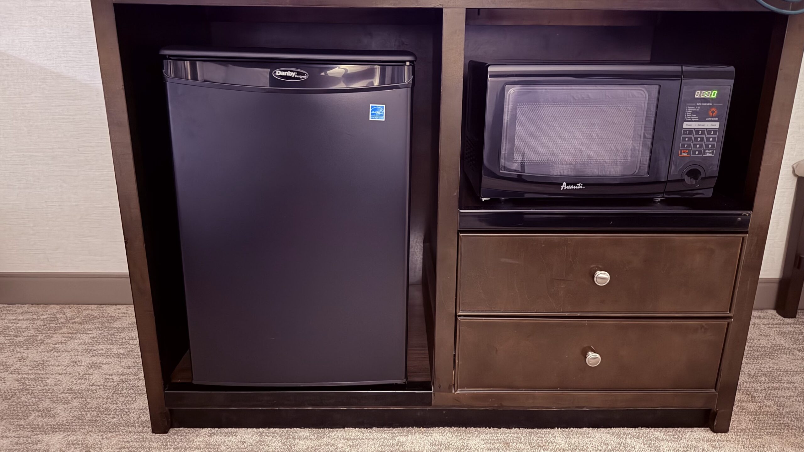 A fridge and microwave oven inside our Queen Room
