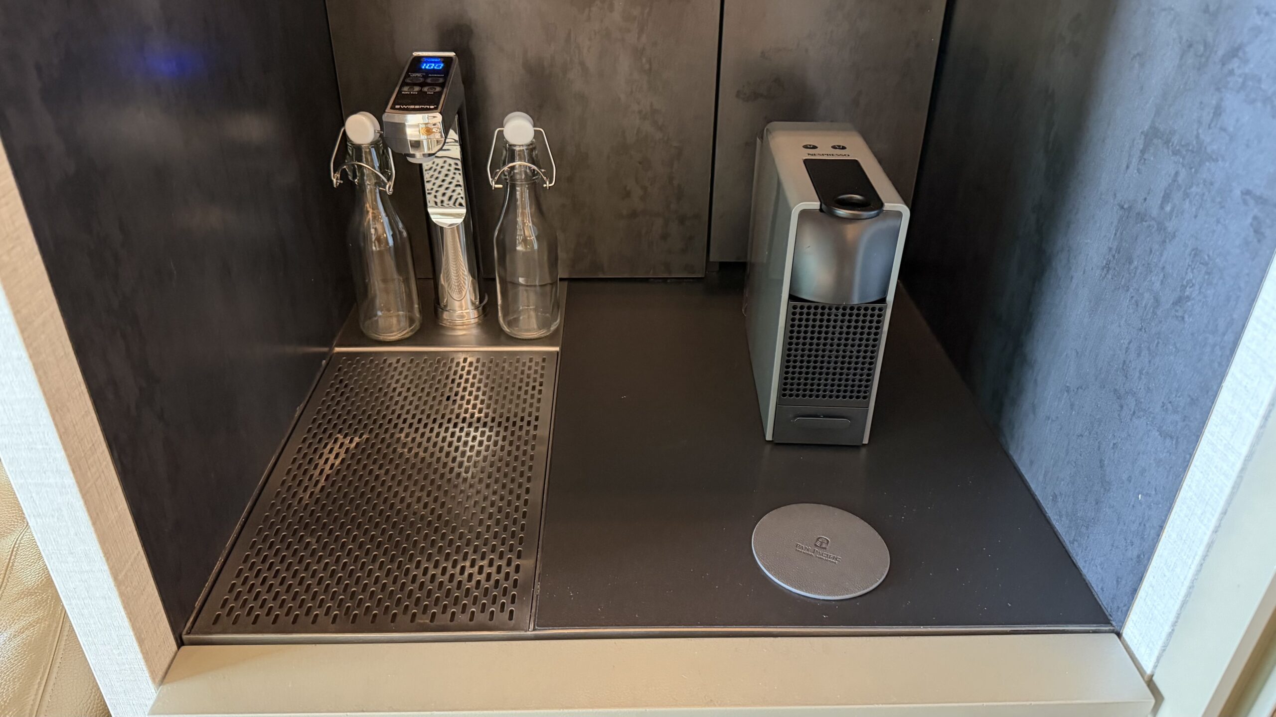 Nespresso machine and refillable water