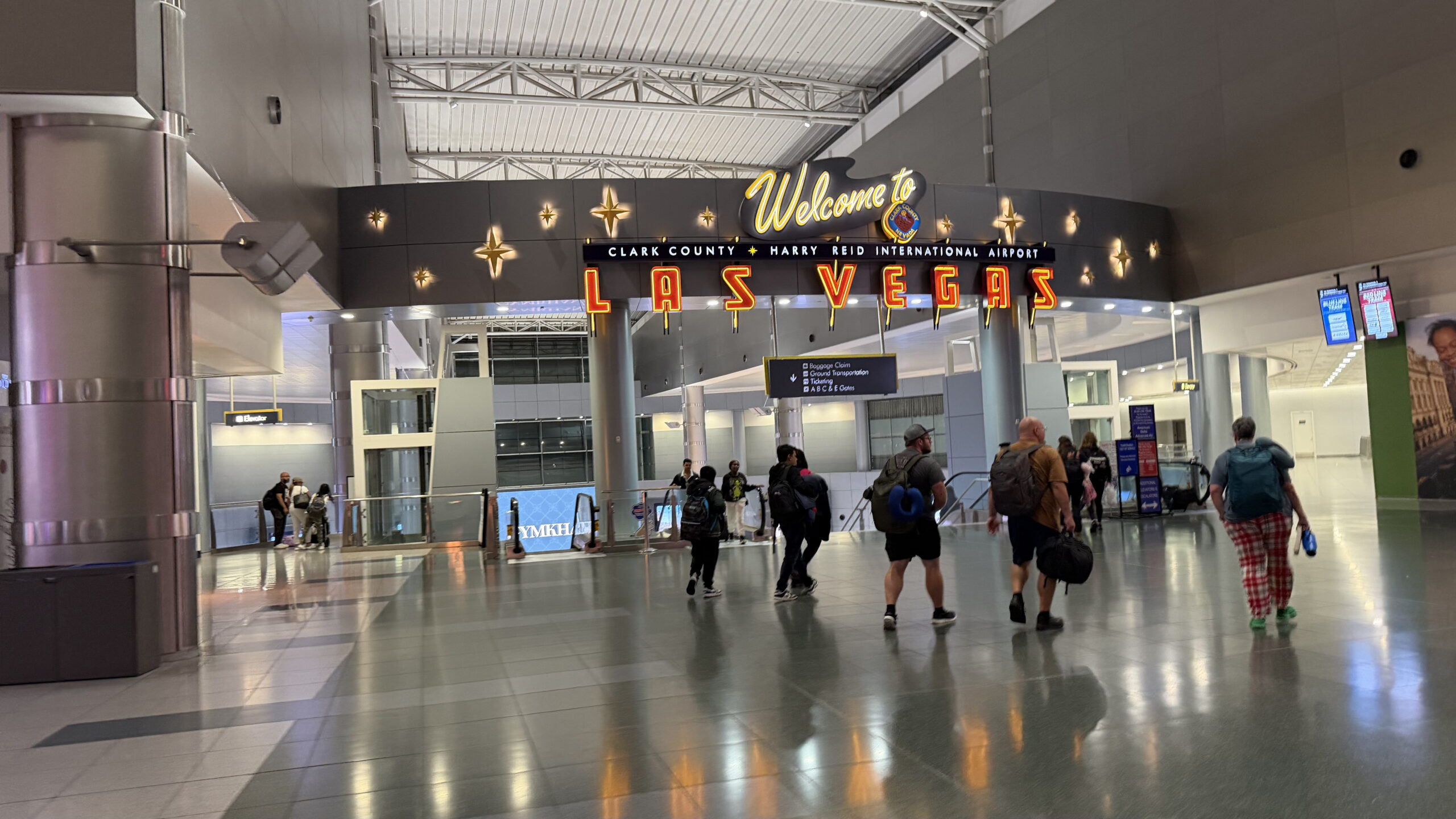 Neon signs greeting those arriving at Harry Reid International Airport
