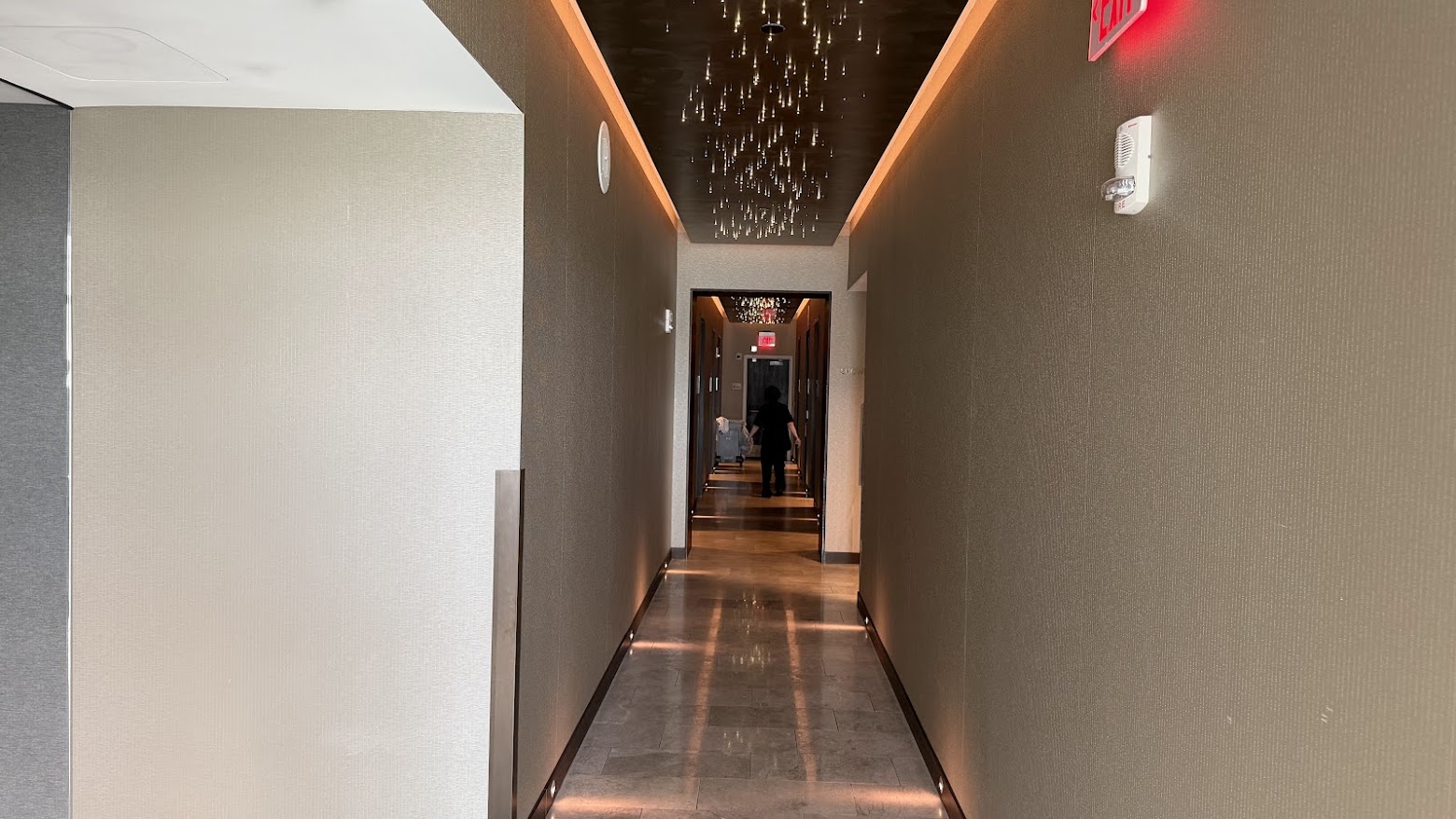 United Polaris Lounge San Francisco corridor leading to the shower suites
