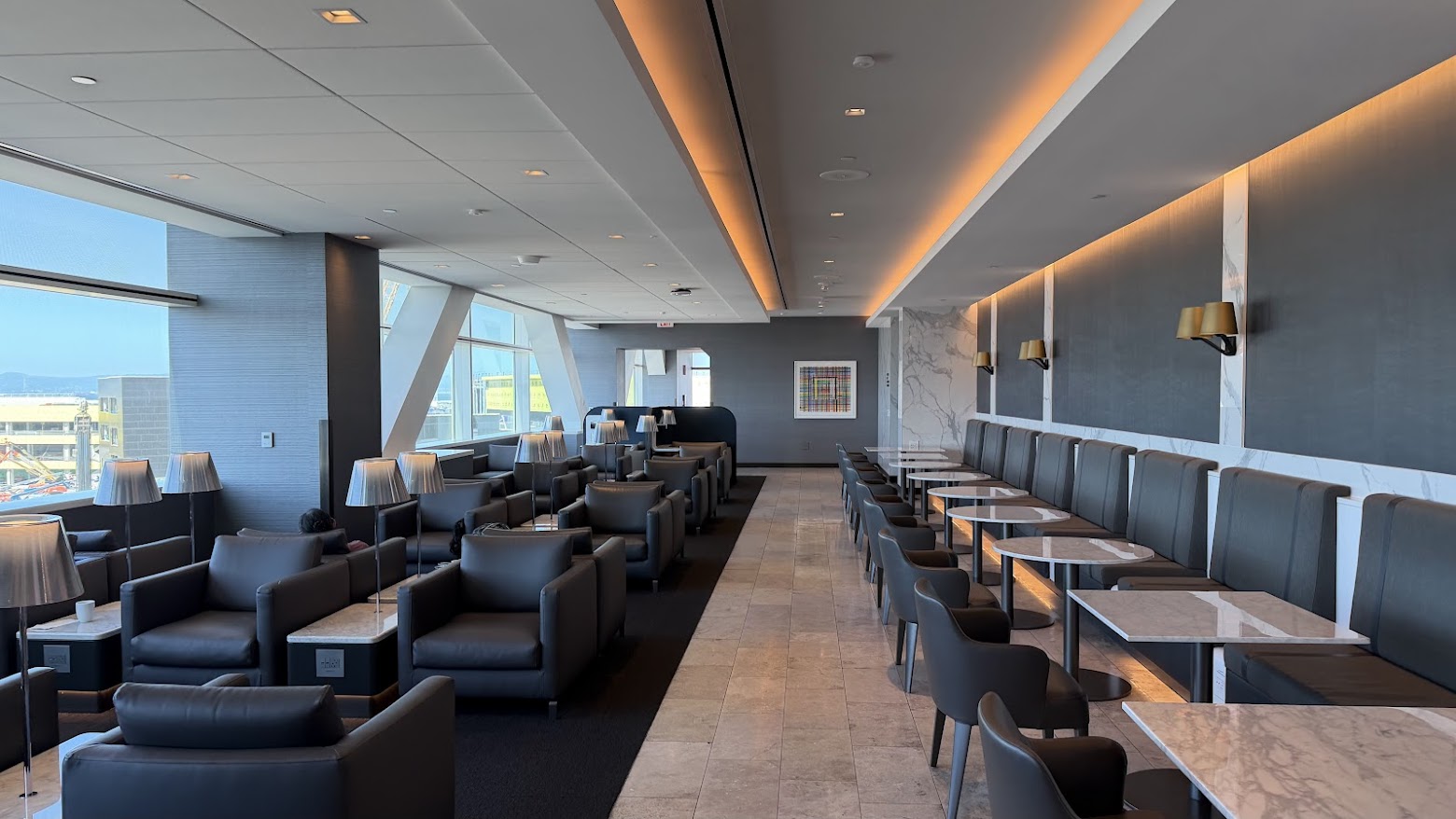 United Polaris Lounge San Francisco smaller hall of the upper floor with a row of dining tables