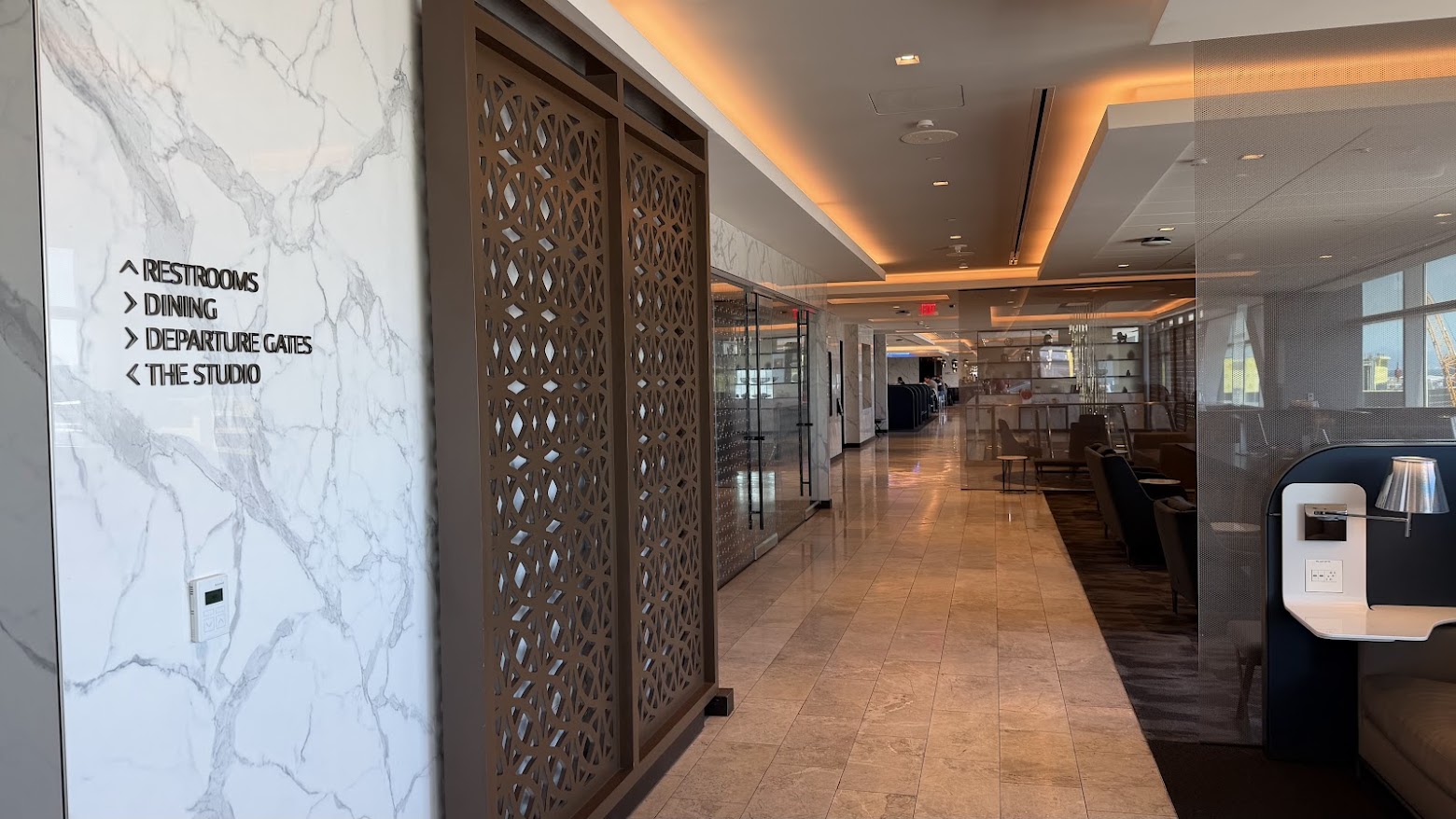 United Polaris Lounge San Francisco with signs showing the various sections of the upper floor