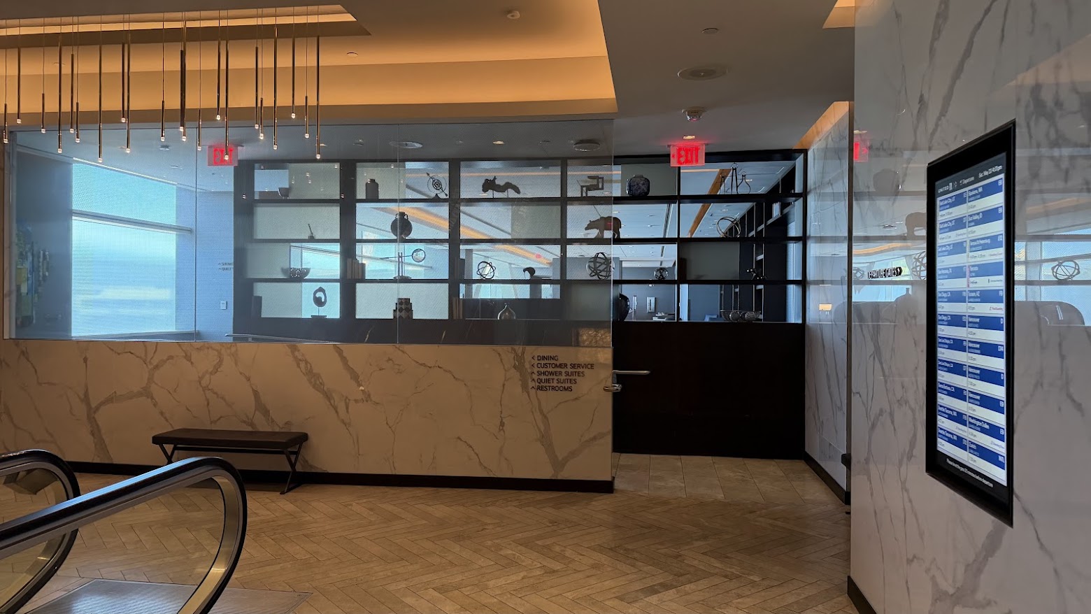 United Polaris Lounge San Francisco decorative shelf installation by the escalator