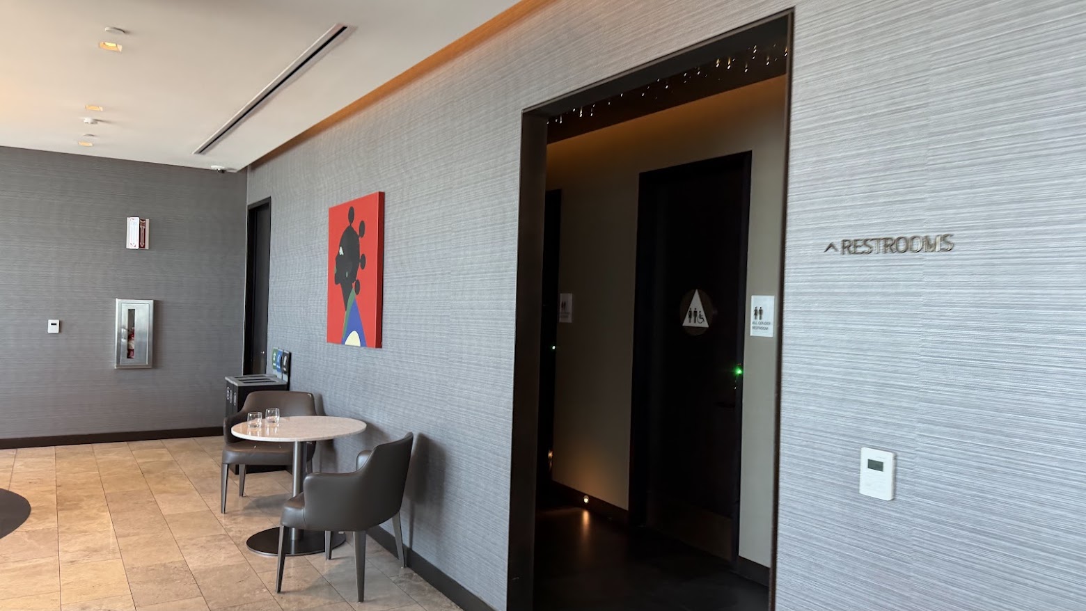 United Polaris Lounge San Francisco lower floor dining tables and restrooms