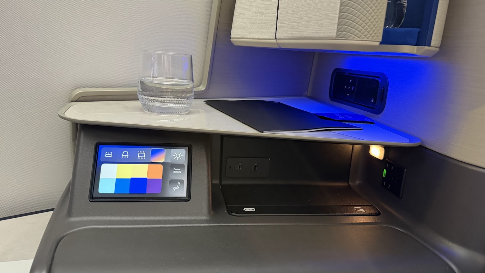 United Airlines UA1 Polaris business class seat console with welcome drink