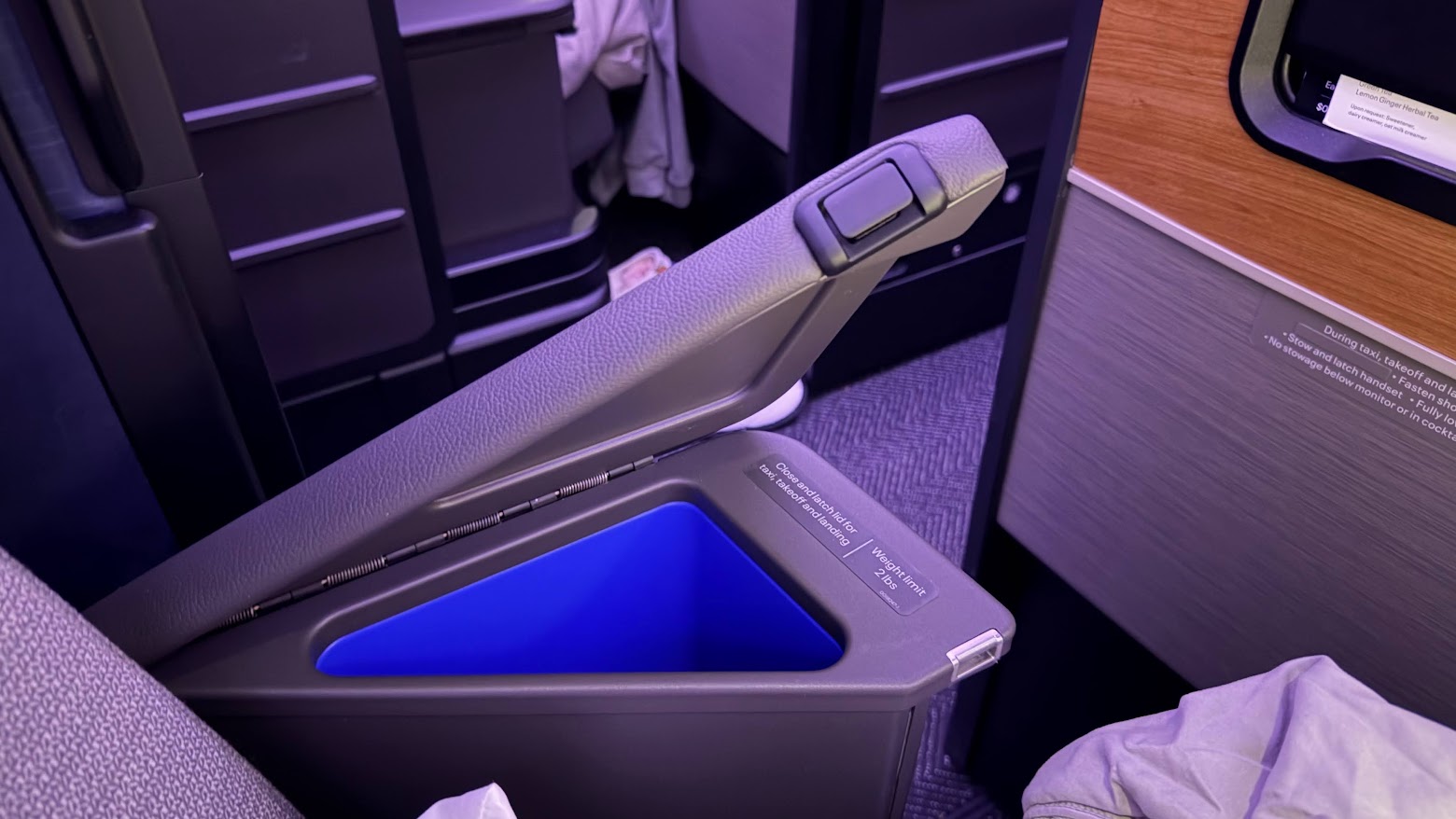 United Airlines UA1 Polaris business class seat armrest compartment