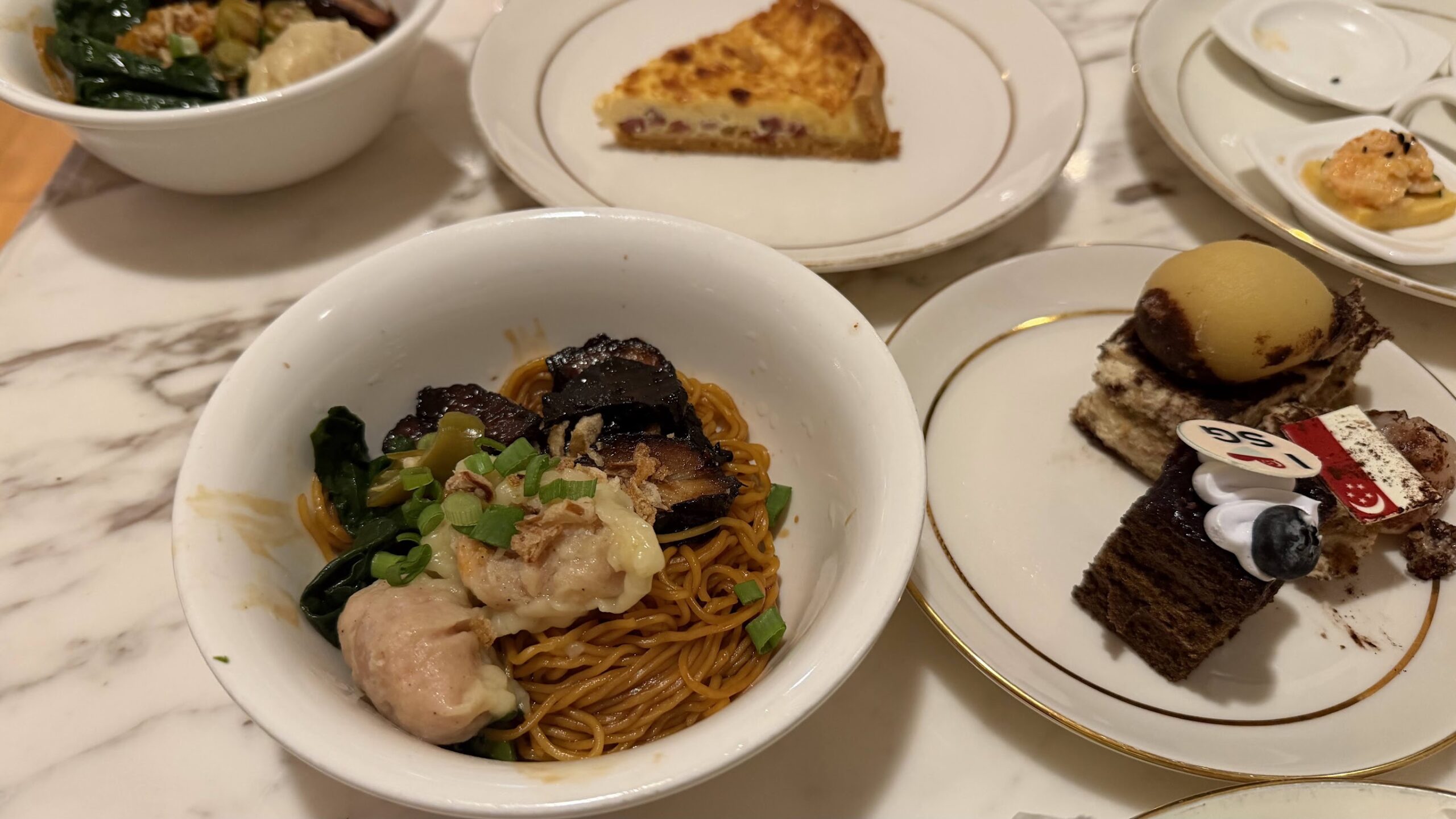 Frasers House Executive Lounge evening canapés plate with noodles and pastries