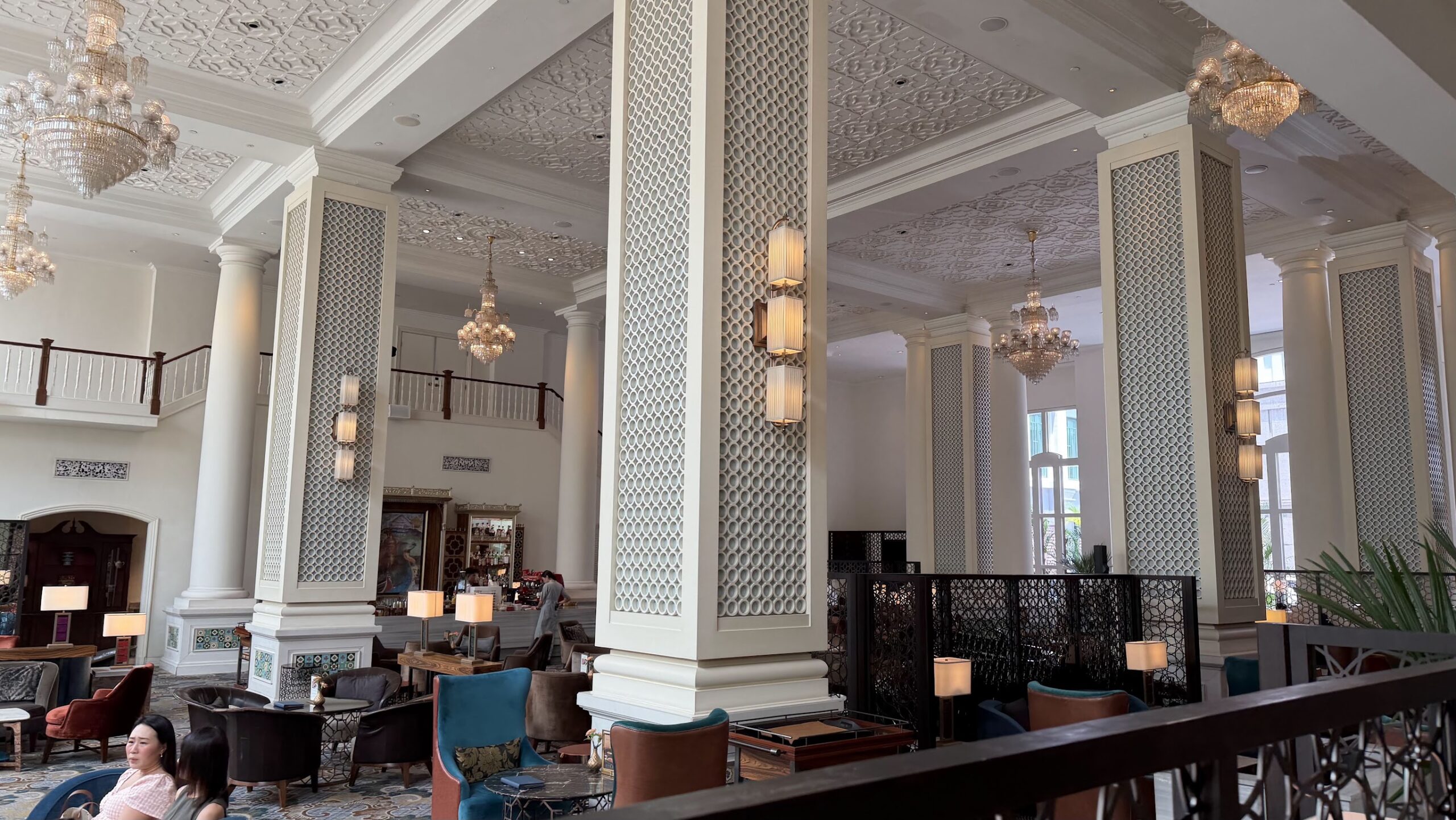 Frasers House lobby with chandeliers and lounge seating