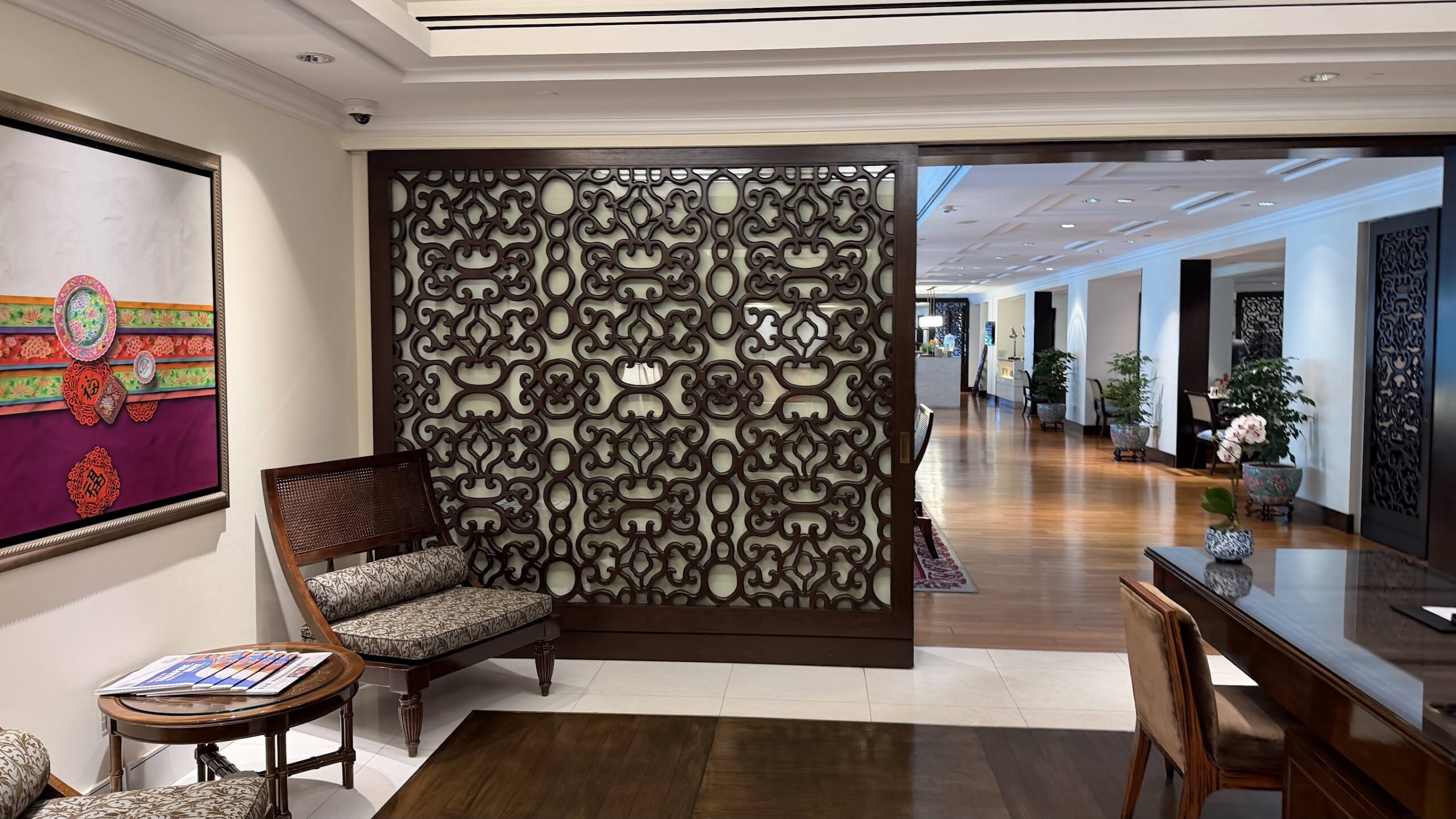 Frasers House hallway with carved screen and armchair
