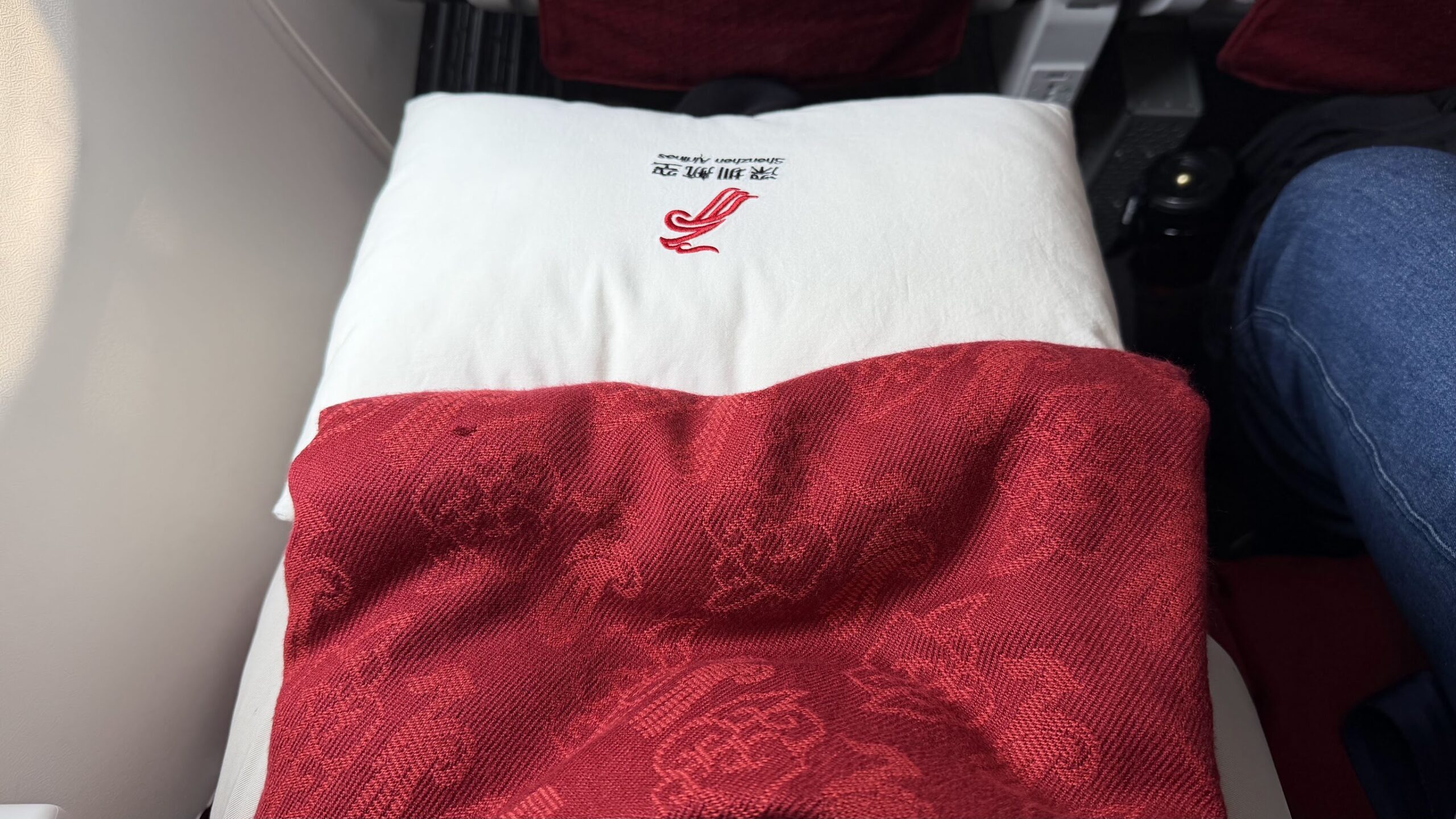 Shenzhen Airlines pillow and blanket in premium economy class