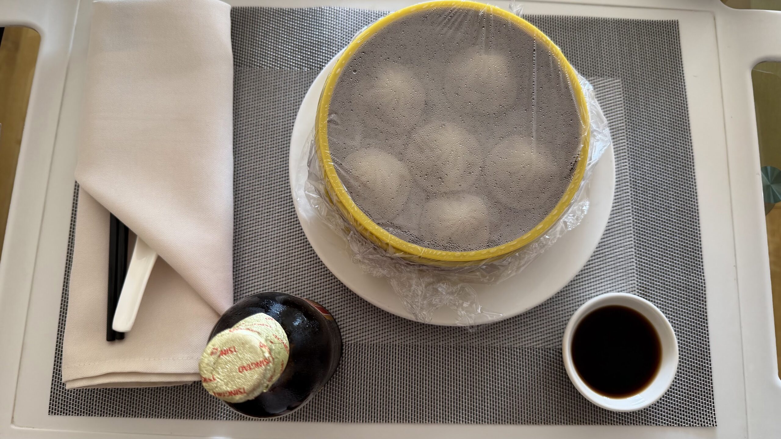 Renaissance Shanghai Yu Garden Hotel welcome amenity tray with a covered steamer, dipping sauce and Tsingtao beer