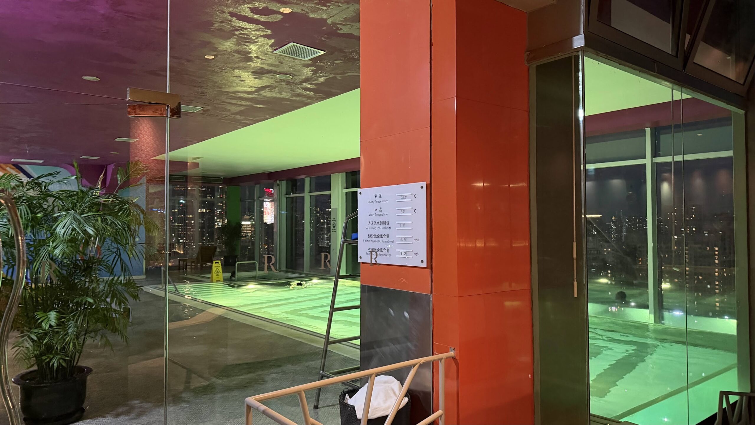 Renaissance Shanghai Yu Garden Hotel indoor swimming pool and city views at night