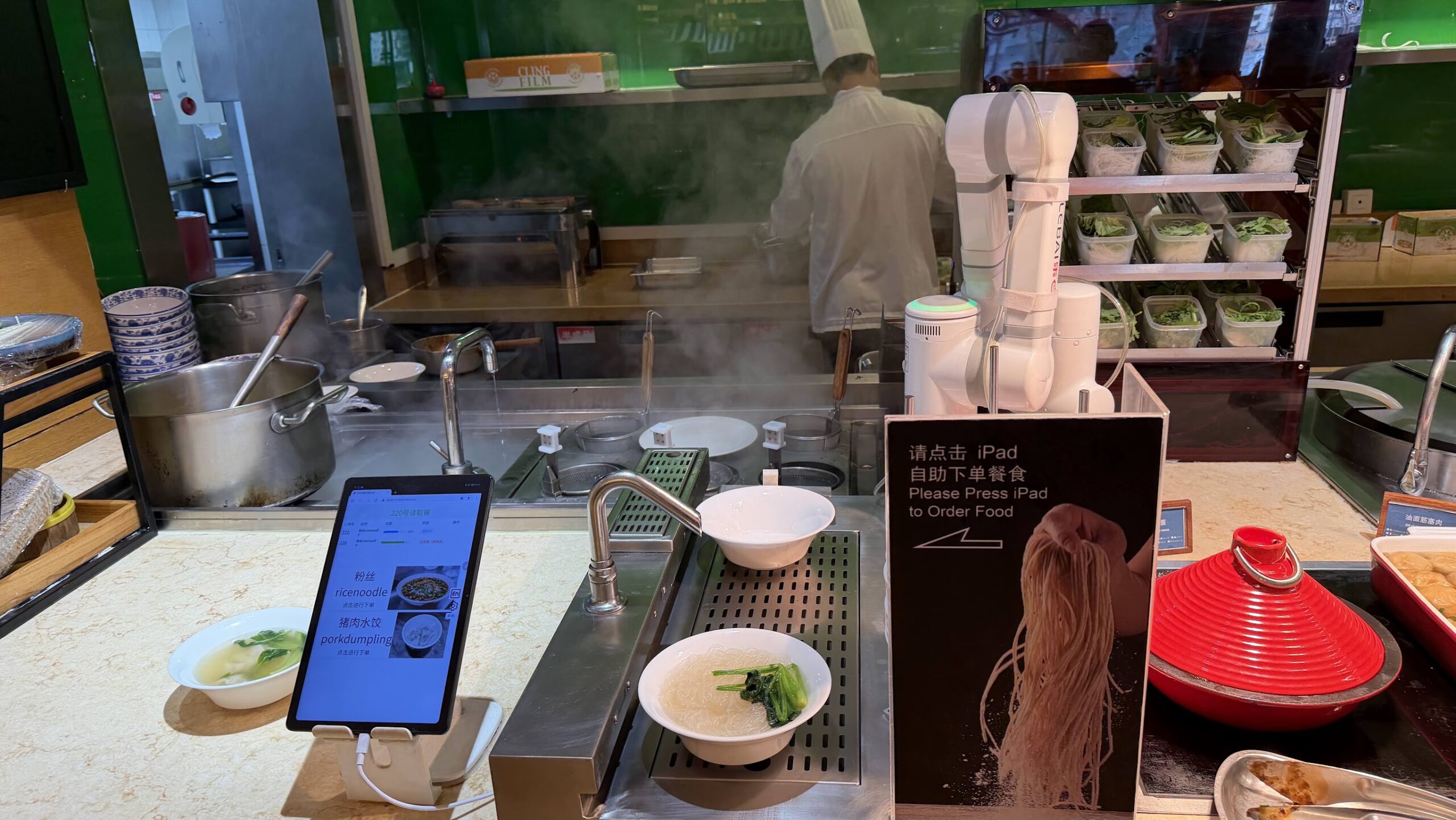 Renaissance Shanghai Yu Garden Hotel Yu Garden Cafe breakfast noodle and pork dumpling station with a robotic arm