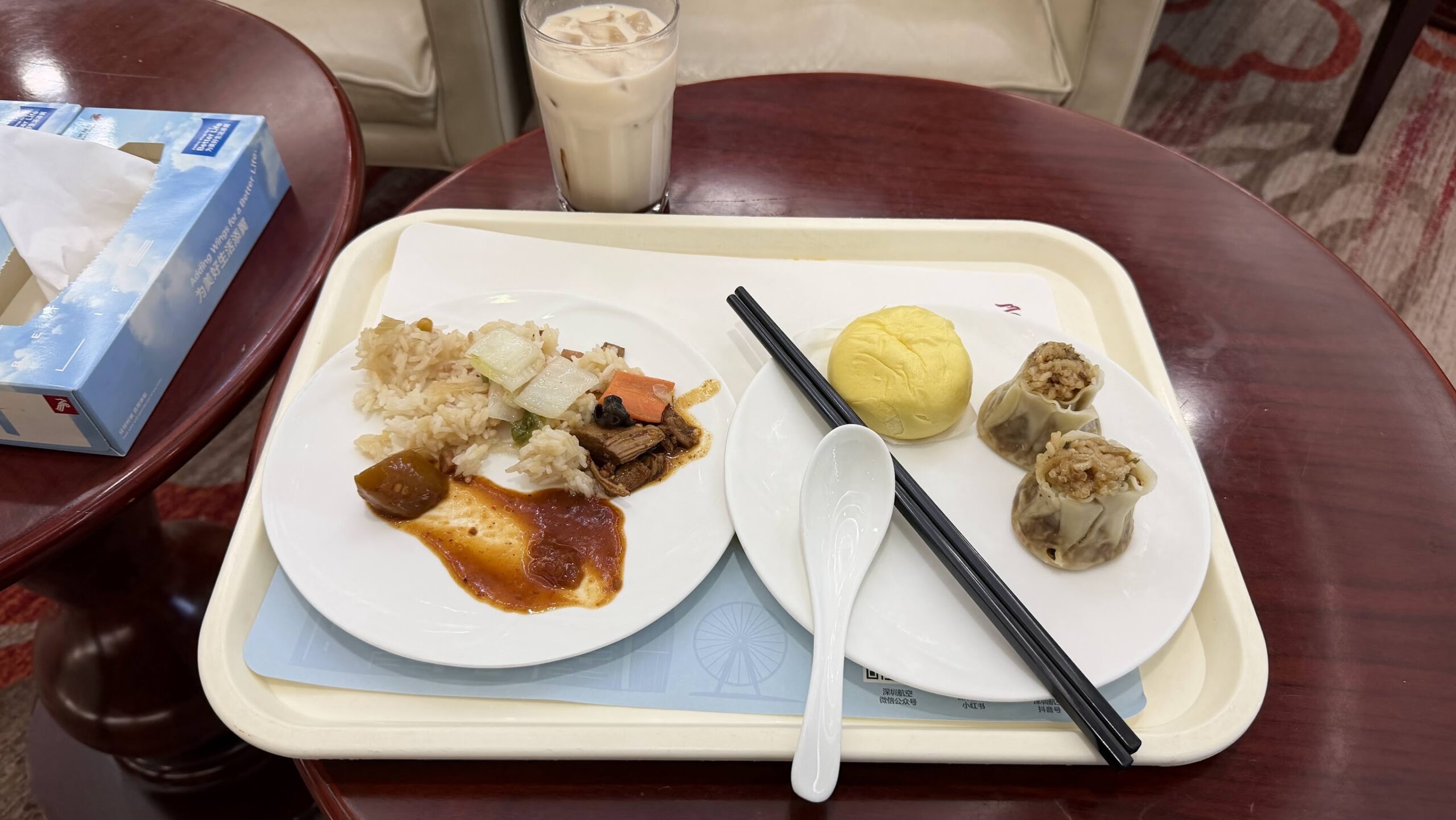 Shenzhen Airlines King Lounge dinner selection with iced milk tea