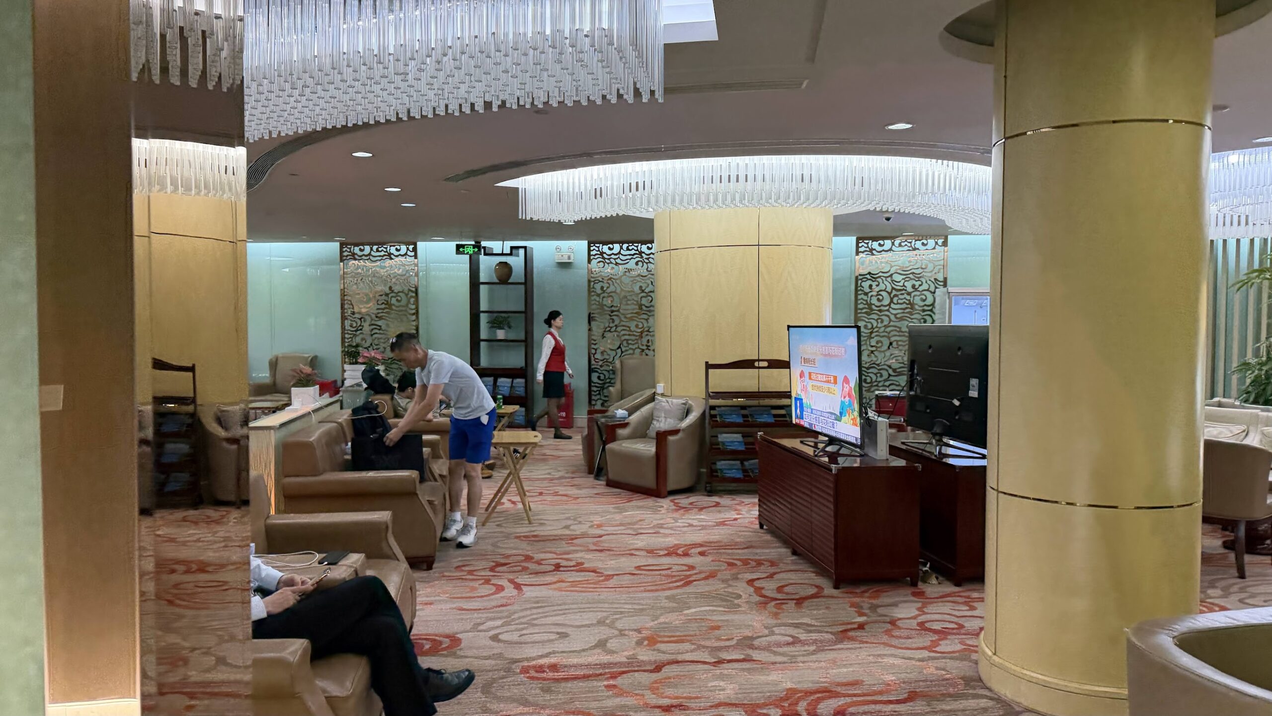 Shenzhen Airlines King Lounge seating area with televisions