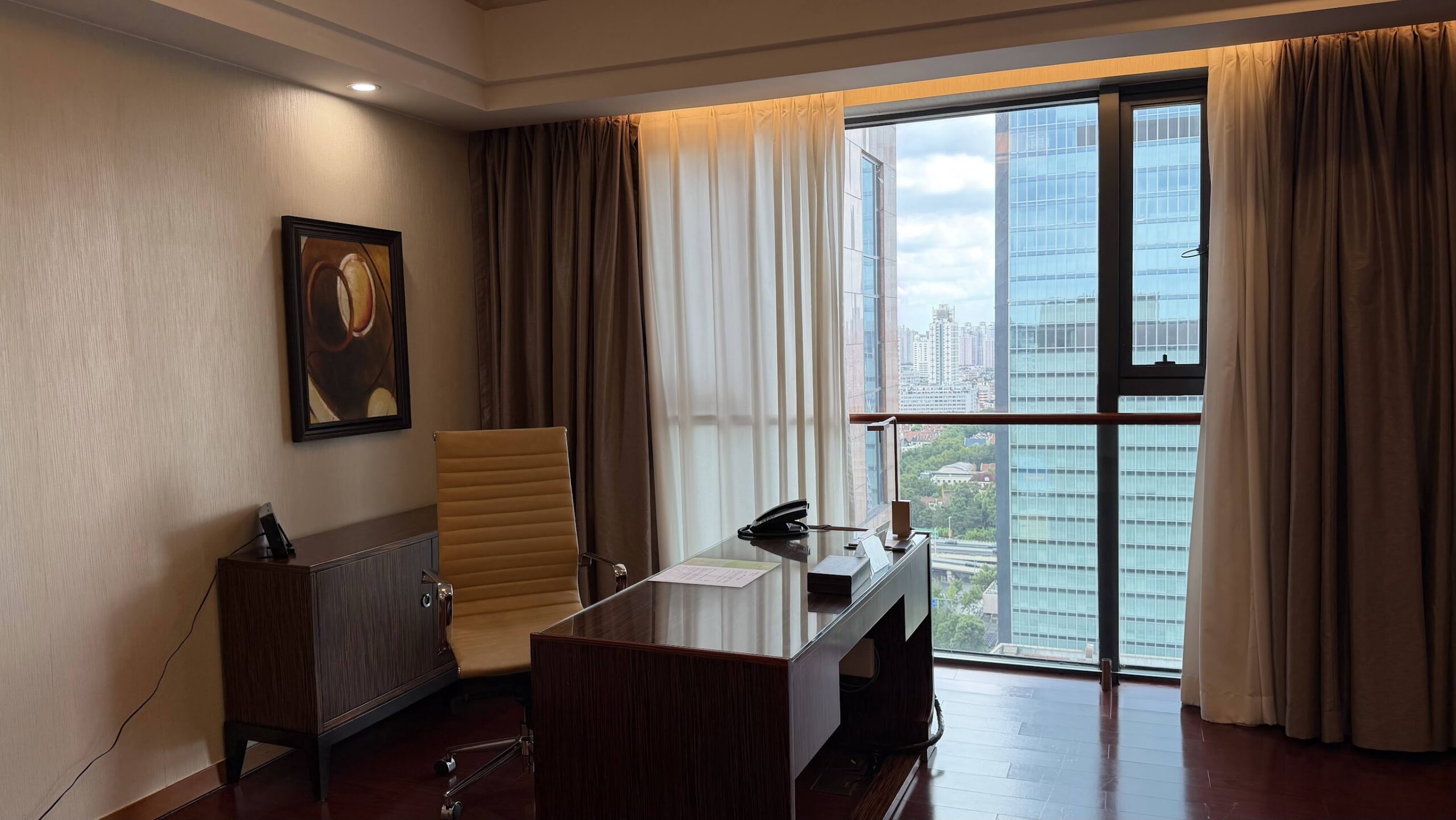 Swissôtel Grand Shanghai Executive Suite work desk and city view