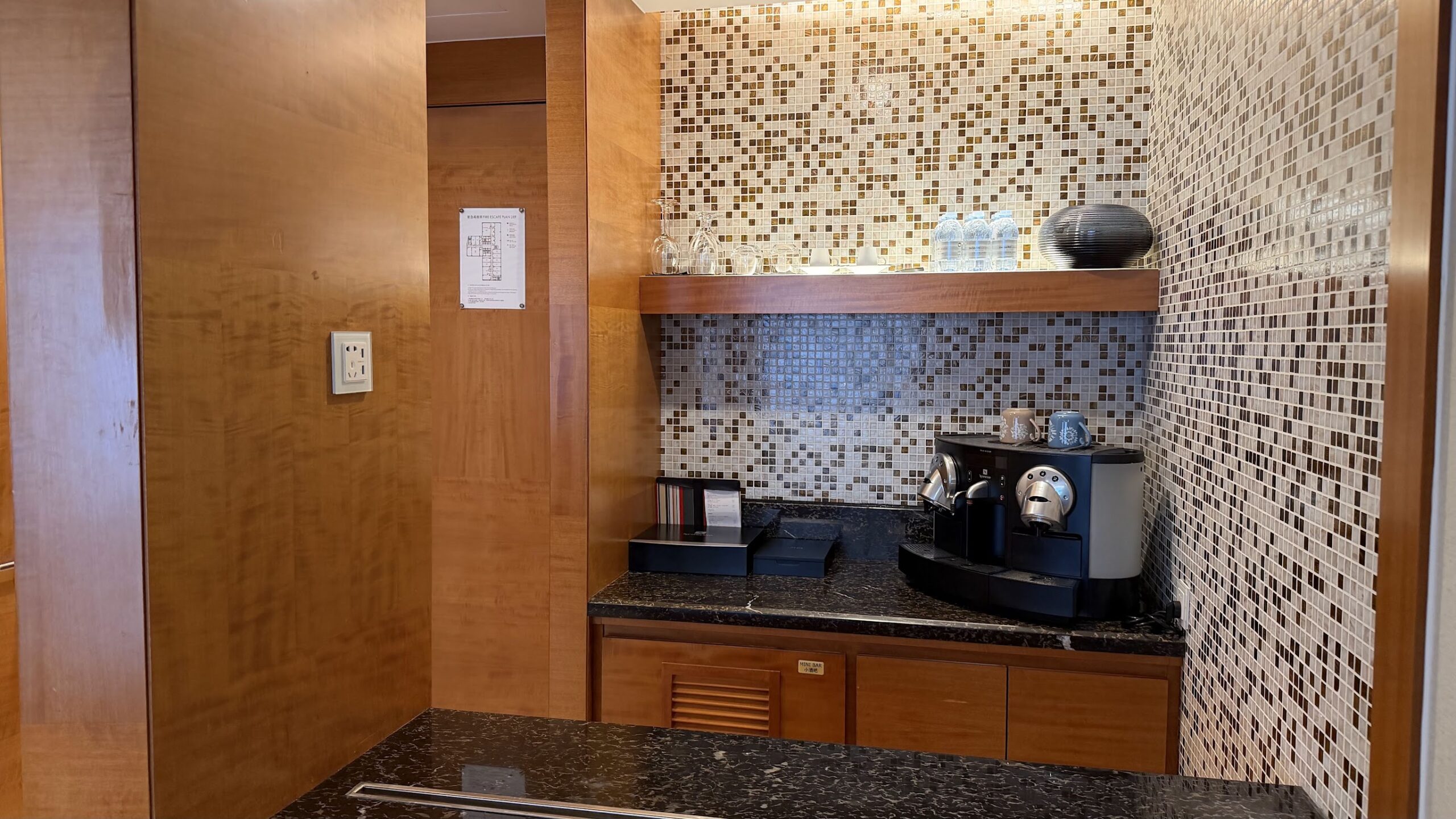 Swissôtel Grand Shanghai Executive Suite pantry with Nespresso Professional machine and bottled water