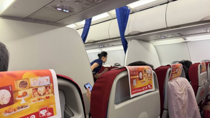 Shenzhen Airlines premium economy cabin divider on flight ZH9509
