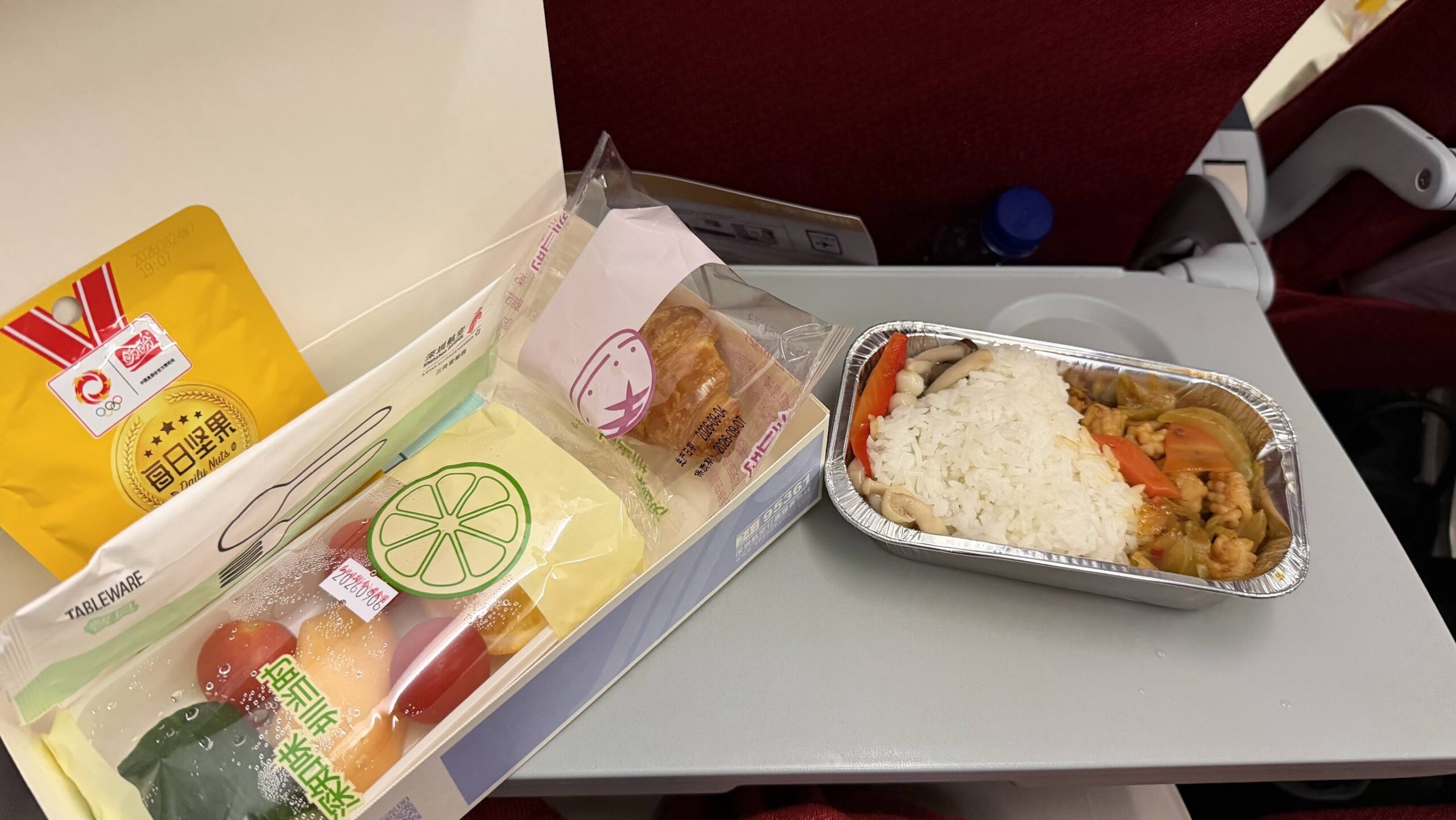 Shenzhen Airlines flight ZH9509 hot meal with rice, fruit and pastry