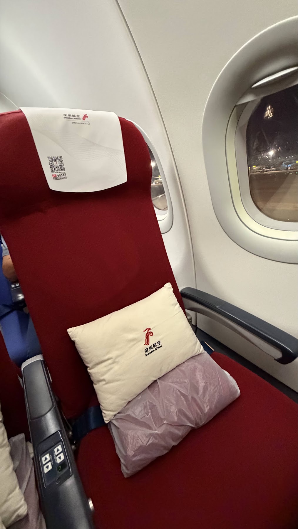 Shenzhen Airlines premium economy window seat and seat controls